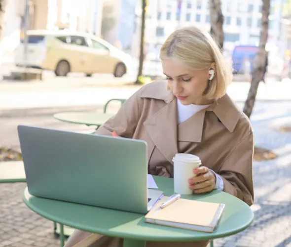woman at cafe table thinking